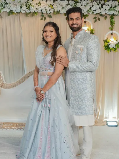 A formal portrait of the couple. The bride's makeup is perfectly balanced, enhancing her features without looking heavy, ideal for ring ceremony photographs.