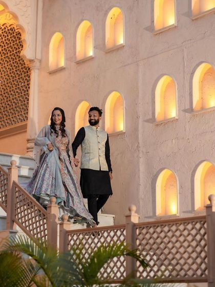 An elegant evening look for the pre-wedding shoot. The makeup transitions to a more defined look that stands out against the beautifully lit architecture.