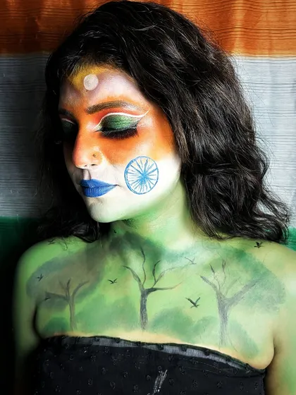 A patriotic body art piece for Independence Day. This look combines the Indian tricolor with nature imagery, showcasing the student's skill in blending and fine-line painting.