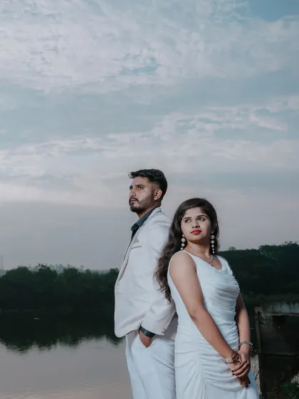 A stylish and modern pose against a beautiful sky. This kind of photo is great for a contemporary and chic wedding announcement.