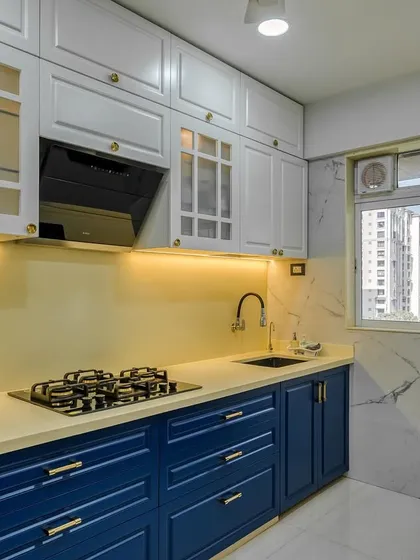 A view of the PU finish kitchen, showing the beautiful contrast between the white and blue cabinets.
