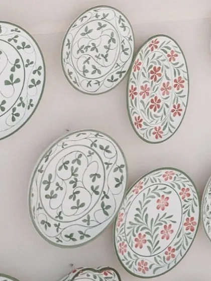 A close-up of the hand-painted ceramic plates used to decorate the bar. These bespoke details are what make a wedding truly one-of-a-kind.