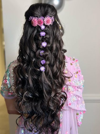 Another shot of this lovely floral hairstyle, showing the beautiful curls and the delicate placement of the flowers.