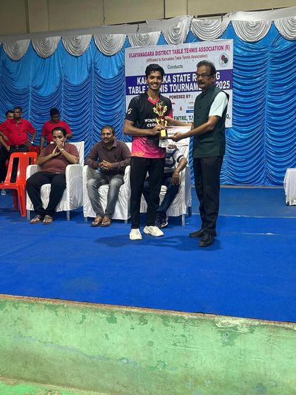 Shrikant Kashyap receiving his trophy for being the Men's Singles Runner-Up at the Hospet state ranking tournament.