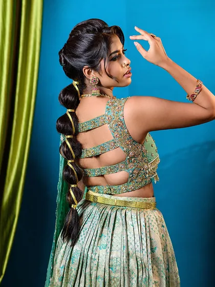 This angle highlights the unique back design of the blouse and the modern bubble braid. It’s a great example of how I capture fashion-forward details for designer and MUA portfolios.