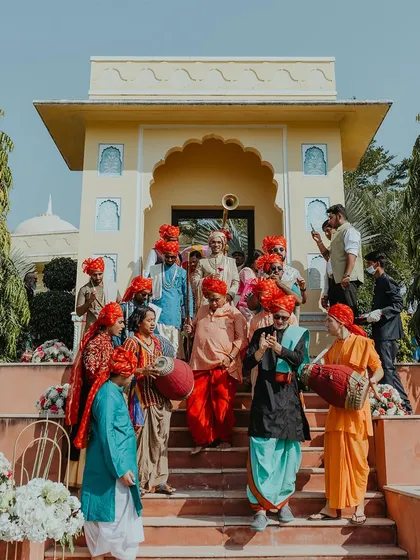 The groom's 'Baraat' or wedding procession, filled with music, dancing, and colorful traditional attire.