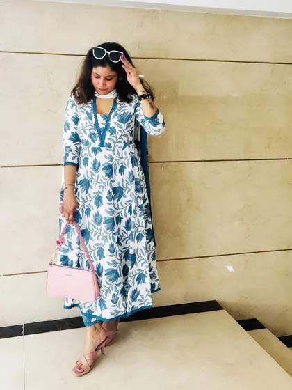 Modern desi style is all about comfort and elegance. This blue and white floral cotton kurta set is perfect for a sunny day out, combining traditional prints with a contemporary silhouette for a look that's effortlessly graceful.