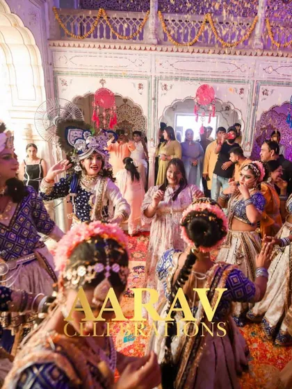 The joy of 'Phoolon ki Holi' is infectious. Here, guests join the Raasleela dancers, celebrating with dance and flower petals in a truly immersive and festive experience.