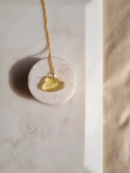 My 'megh' lemon quartz cloud pendant. I recommend this stone for reducing anxiety and improving focus and concentration. Its sunny color brings a sense of calm.