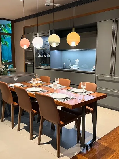 This angle shows the handle-less cabinetry in Satinated Glass Lava Grey, which provides a soft, matte finish that is both elegant and easy to maintain.
