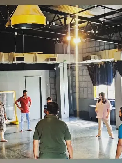 A shot from an acting workshop, with participants engaged in a theatre game. The open, industrial floor plan is perfect for movement-based exercises.