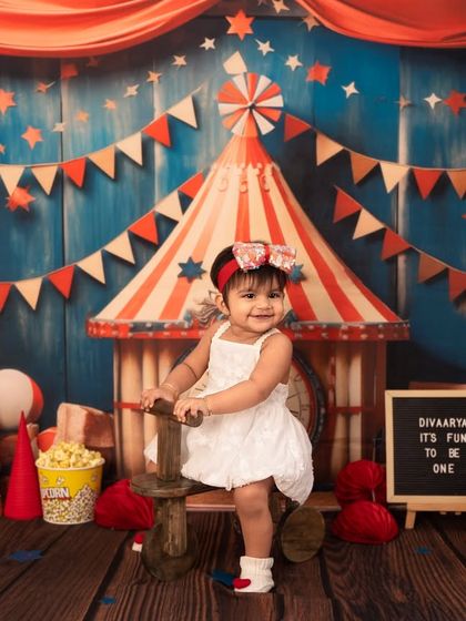 Taking a ride on a vintage-style wooden horse. I incorporate interactive props like this to keep the session fun and engaging for the little ones.