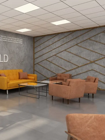 A comfortable seating arrangement in the faculty lounge at BML Munjal University. The combination of industrial-style concrete walls with warm upholstery and wood tones creates a modern yet inviting atmosphere for relaxation and collaboration.