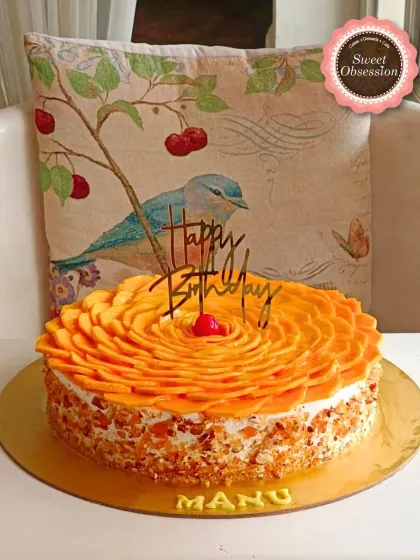 This Fresh Alphonso Mango Cake is a perfect example of how I use seasonal ingredients. Made for a Mother's Day celebration, it features a beautiful rosette of fresh mango slices and a crunchy nut coating.