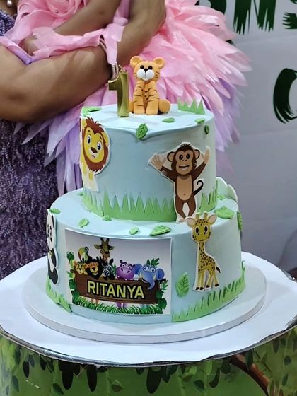 This jungle-themed birthday cake features a cute little tiger cake topper that I sculpted. It was for a first birthday celebration, and I was so happy to contribute a small part to such a special day.