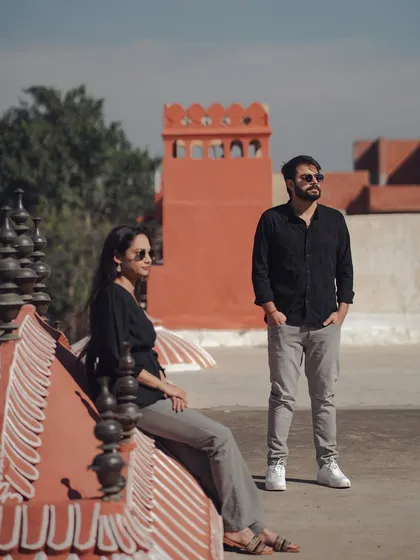 A stylish, editorial-style shot from a rooftop overlooking Jaipur. This showcases our ability to create modern, cool pre-wedding photos that still incorporate the city's iconic heritage.