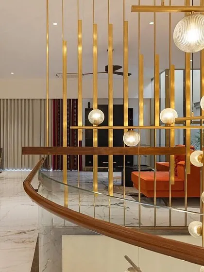 The grand view of the family lounge, showing the interplay of our furniture, the architectural details, and the dramatic lighting.
