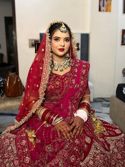 My bride Nikita, looking so pretty and poised. The soft glam makeup with a red lip is a timeless choice.