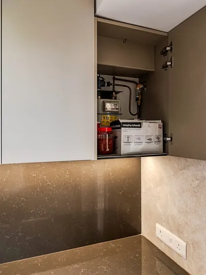 A clever cabinet designed to conceal the gas meter and pipes, ensuring a clean and uncluttered look without sacrificing access.