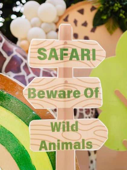 A playful "Beware Of Wild Animals" sign, adding a fun and thematic touch to the safari party decorations.