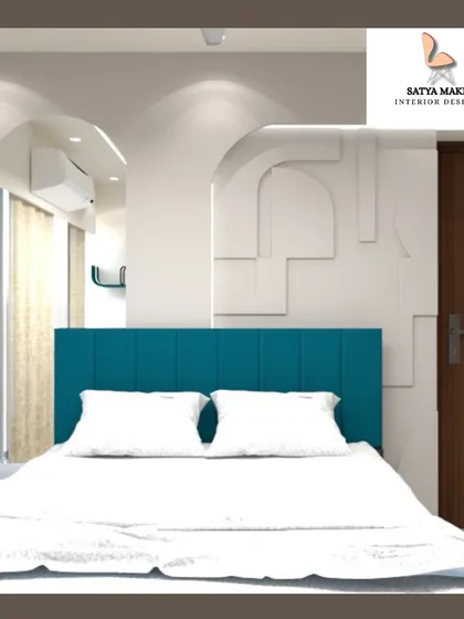 A minimalist bedroom design featuring a clean white wardrobe with an arched detail, complementing the teal headboard.