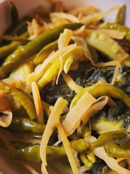 The combination of bitter, spicy, and tangy flavors makes this simple boiled vegetable dish surprisingly complex.