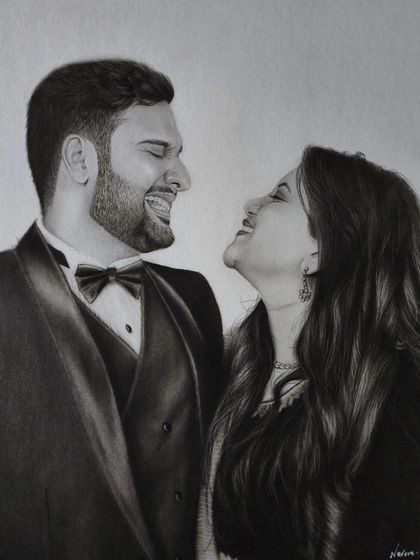A completed A3 portrait of a couple sharing a laugh, drawn on 300gsm Ivory paper. This piece took 14 hours, focusing on capturing their joyful interaction.