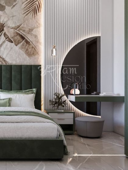 For the master bedroom in the same home, we created a tranquil retreat. The design features a deep green upholstered bed, delicate botanical wallpaper, and a statement backlit mirror, all coming together to form a space of calm, contemporary elegance.