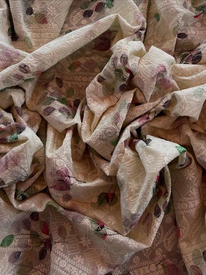 A full view of our printed and embroidered cotton, showing how the fabric drapes. It's soft, detailed, and perfect for a summer suit set.