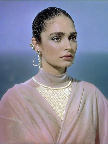 A regal portrait of Kavya Trehan. The intricate pearl details and her poised expression give this image a sense of classic, futuristic royalty.