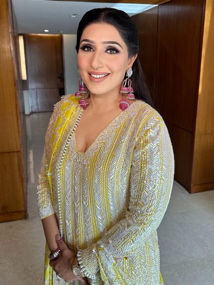 A close-up of the soft hairstyle, showing the gentle waves and how it frames the face beautifully.