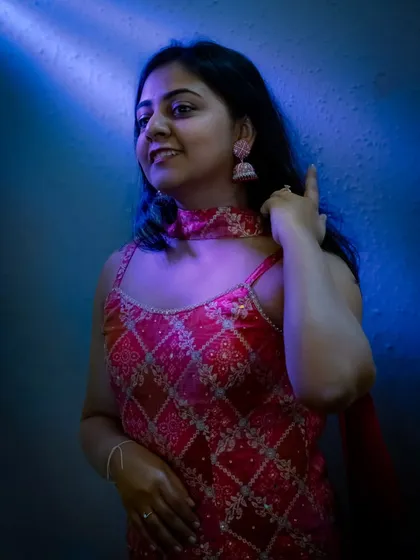 My cinematic photography style in action. I use creative lighting, like this dramatic blue hue, to create moody and artistic portraits that make your event photos look like stills from a movie.