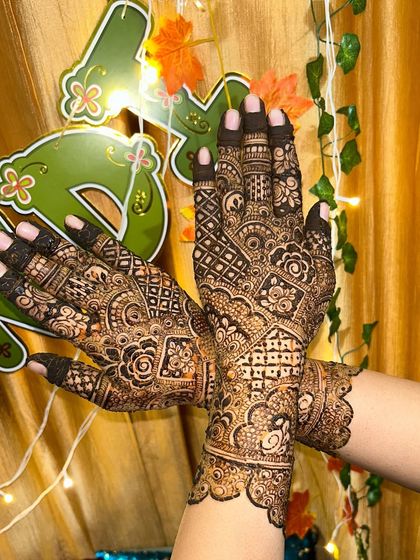 A beautiful and intricate design, perfect for a wedding guest or a festive occasion.