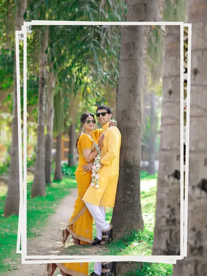 A cool and casual couple portrait during their Haldi event. The sunglasses add a fun, modern twist to their traditional yellow outfits.