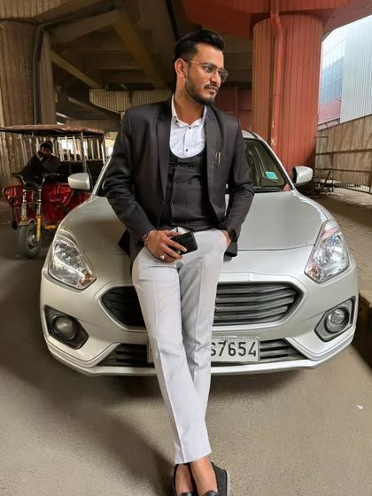 Posing with my car. Hard work brings its own rewards.