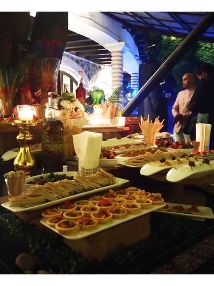 A high tea spread featuring an assortment of sandwiches, tarts, and other small bites. Our high tea menus are perfect for daytime celebrations, bridal showers, or corporate events.