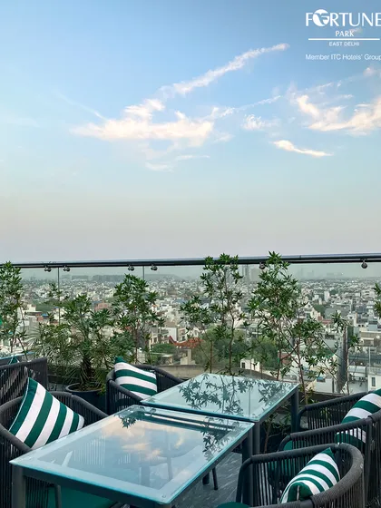 This is the view from Nakshatra, our rooftop restaurant. We've set the table for an unforgettable evening overlooking the city skyline, where the ambiance is as captivating as the cuisine.