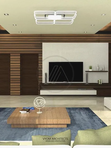 A spacious and modern living area where I've used a combination of wood paneling, a neutral color palette, and clean lines to create a sophisticated yet comfortable family space. The design focuses on uncluttered surfaces and a seamless flow.