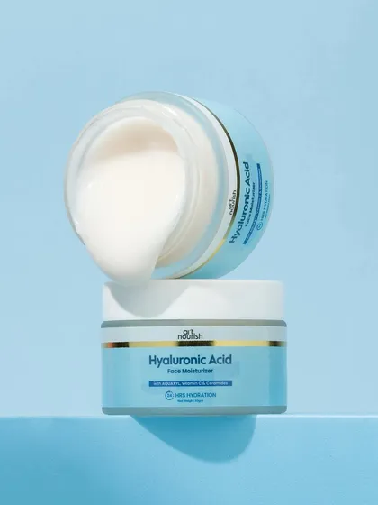 We love a good texture shot. This image showcases the rich, creamy texture of the moisturizer as it spills over the edge of the jar, making it look indulgent and highly effective.