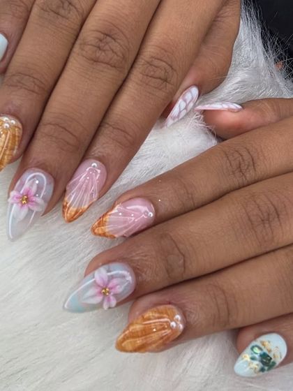 A different view of the beach-themed FiDi nails, showing the details on each finger.