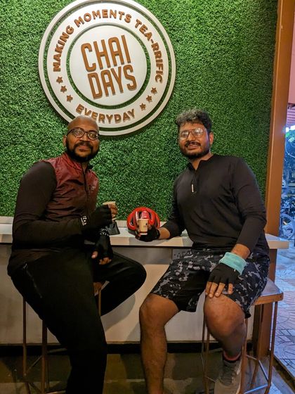 Two of our riders enjoying a well-earned break at Chai Days. These moments are just as important as the ride itself, giving us a chance to relax and chat.