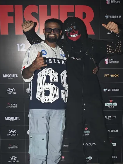 Posing with Almost Human at a press wall for a Fisher event. Our collaboration extends beyond the decks, representing a strong partnership in the industry.