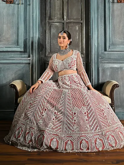 A wide shot that captures the grandeur of the outfit. The simple yet elegant bun ensures the overall look is balanced and not overwhelming.