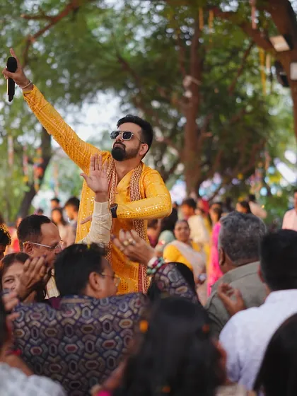 Getting the crowd hyped up during a Haldi celebration in Silvassa. My goal is to have every hand in the air.