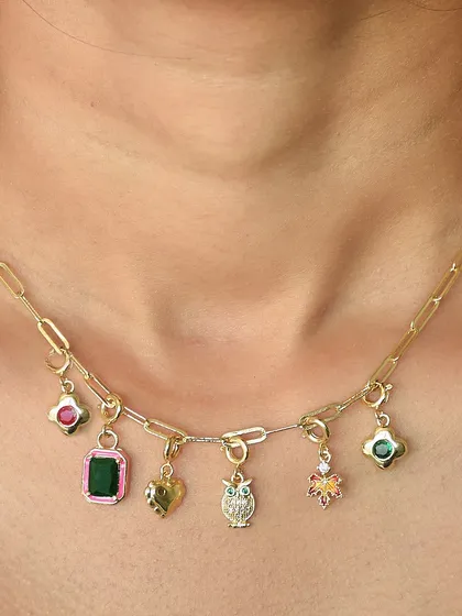A close-up of a custom charm necklace, worn by a client. I love seeing the unique combinations you come up with.