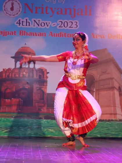 A graceful turn during my solo performance. The flow of the costume and the elegance of the posture are hallmarks of the Bharatanatyam aesthetic.