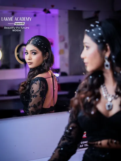 A creative mirror shot of a black-themed party look. This demonstrates how to use reflections and angles to create compelling portfolio images.