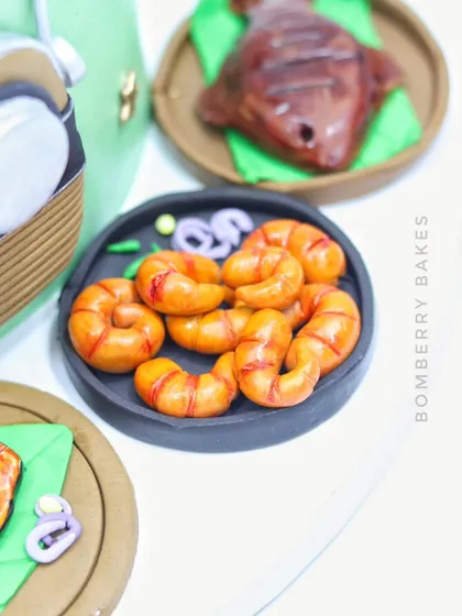 A detailed shot of the incredibly realistic-looking fried prawns, all made from fondant.