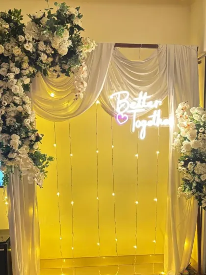 The same 'Better Together' setup shown with warm yellow lighting, demonstrating how the ambiance can be changed. We can adjust the lighting to match the mood of your event.