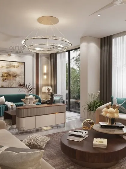 A closer view of the bright and airy living room, showing the connection to the outdoor patio. The neutral sofas are accented with teal cushions, creating a fresh and inviting atmosphere.